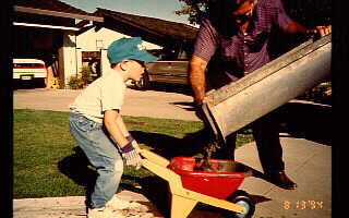 Photograph of Travis helping